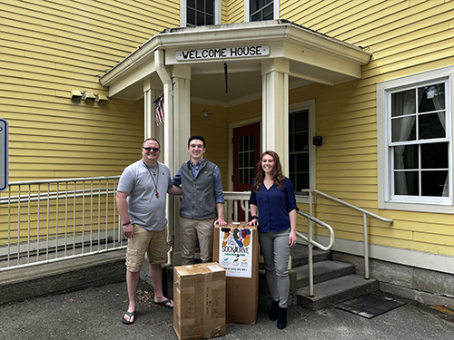 Sullivan Tire team delivering socks to the Welcome House Organization